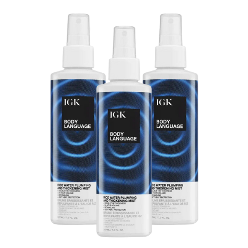 Three bottles of IGK Body Language hair thickening mist on a white background.