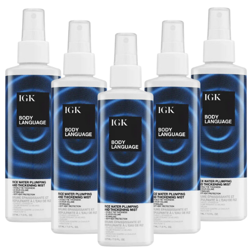 Five bottles of IGK Body Language mist with blue and black packaging.