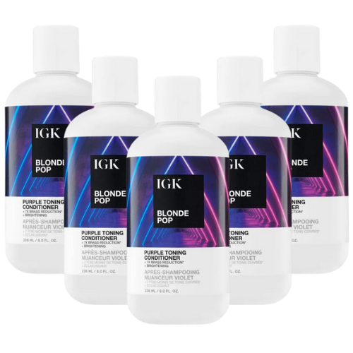 Five bottles of IGK Blonde Pop Purple Toning Conditioner with colorful geometric labels.