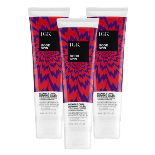 Three tubes of IGK Good Spin curl-defining gel with vibrant packaging.