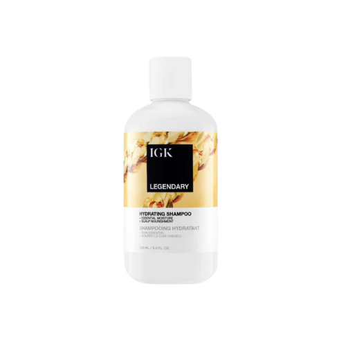 Bottle of IGK Legendary Hydrating Shampoo with a floral design label.