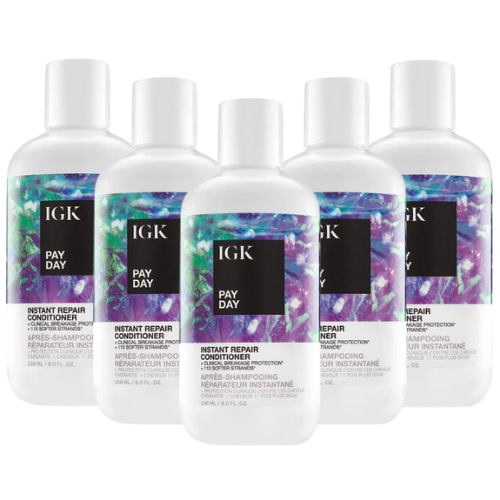 Five bottles of IGK Pay Day Instant Repair Conditioner arranged in a group.